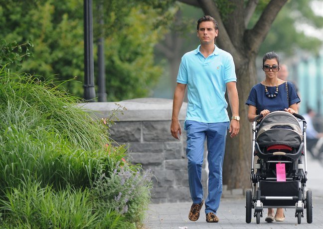 Kourtney Kardashian, sunglasses, navy blue blouse, necklace, bracelet, Scott Disick, aqua shirt, blue pants, leopard shoes