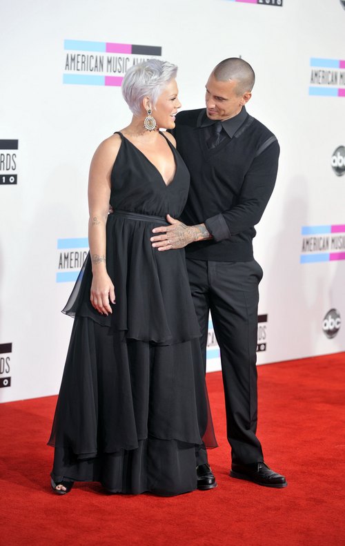 Pink, sleeveless black dress, CArey Hart, black suit