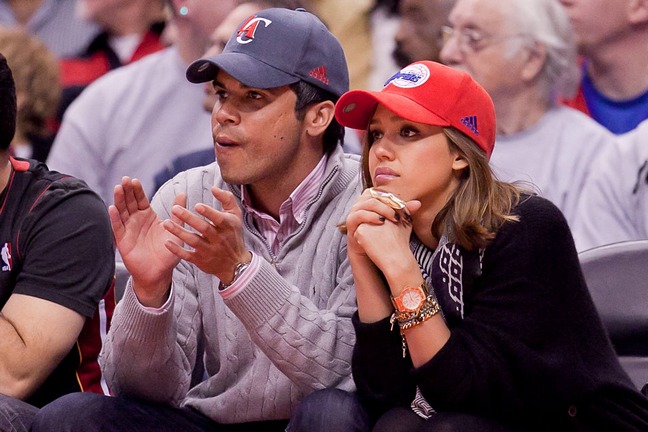 Jessica Alba, baseball hat, orange watch, black jacket