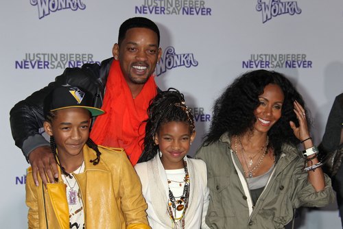 Will Smith red scarf, Jada Pinkett Smith green jacket