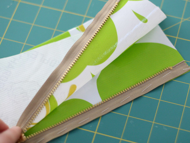 green apple fabric with gold zipper