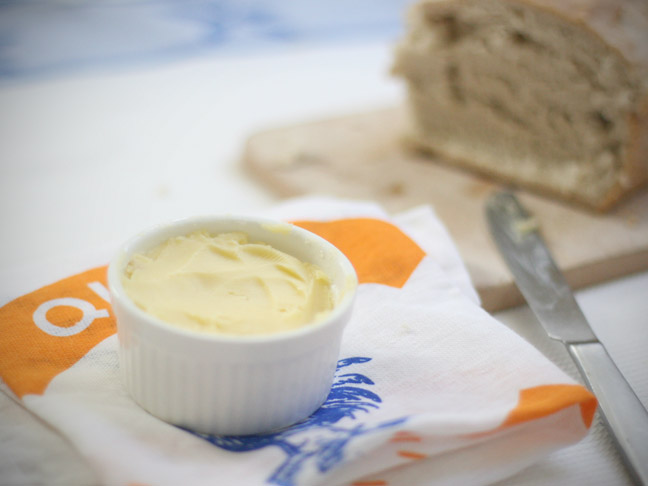 fresh butter ramekin on towel