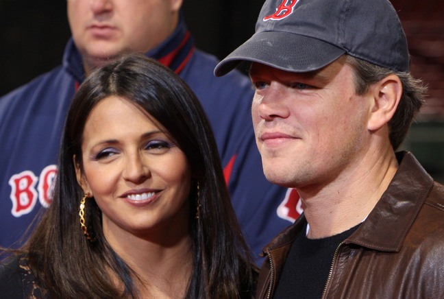 Matt Damon blue baseball hat, brown leather jacket