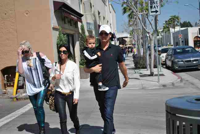 Kourtney Kardashian, animal print purse, white blouse, jeans