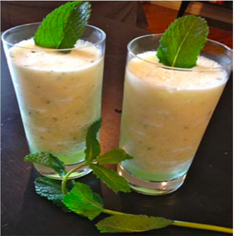 two melon cocktails in a highball glass