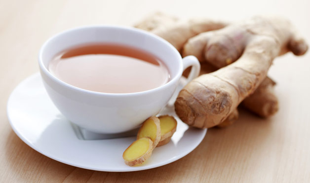 Detox Immunity Tea Recipe pictured in a white porcelain cup with fresh ginger