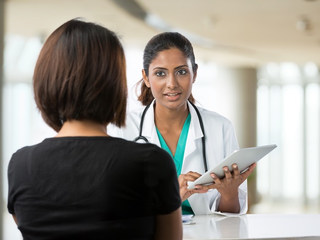 woman talking to doctor