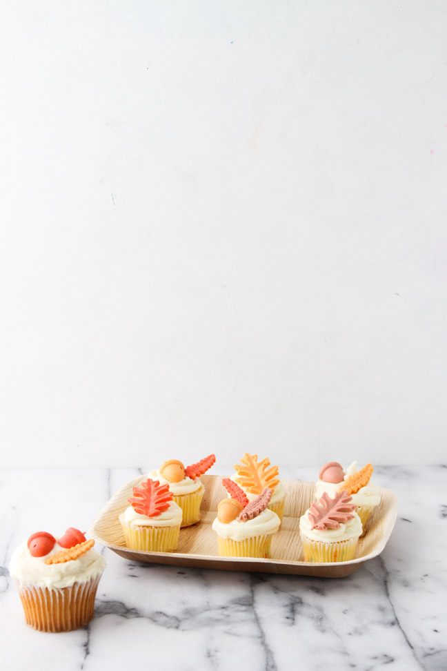 Completed cupcakes with fall leaf toppers