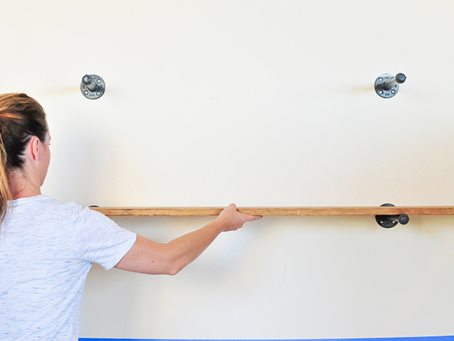 Hanging wood to create industrial wall shelves