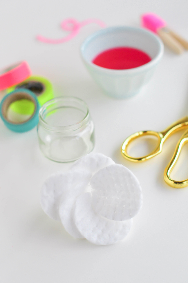 folding round cotton pads in a flower petal shape