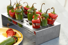 Stuffed peppers are delicious and super simple to make on the grill with this BBQ safe holder.