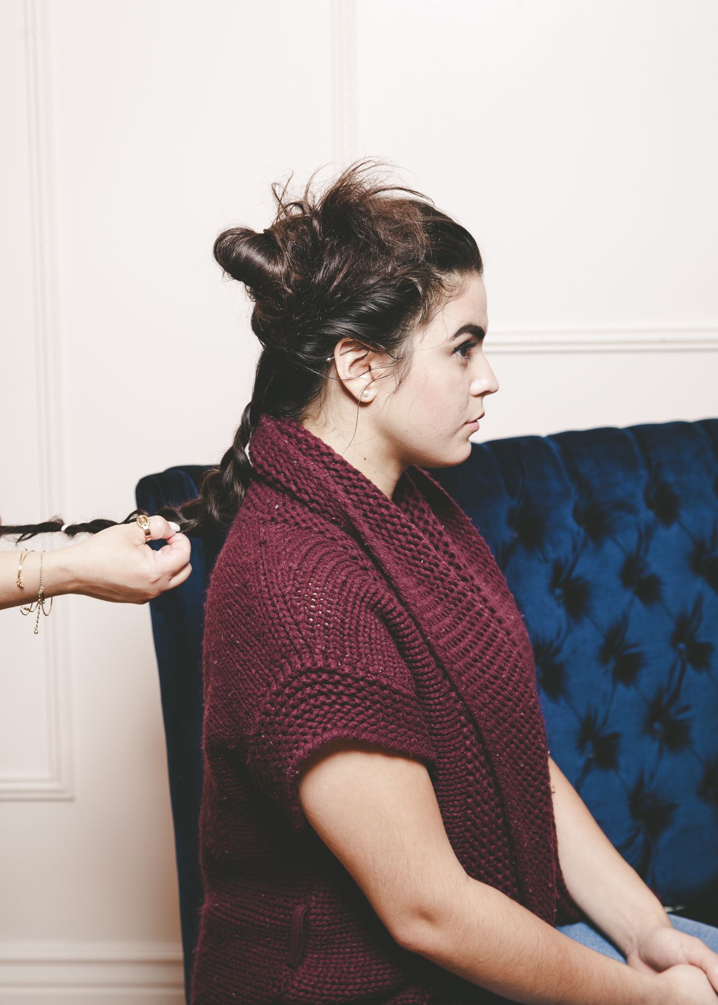 braiding hair to create top knot