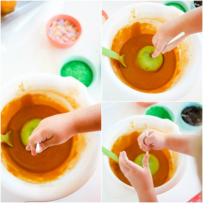 toddler dipping caramel apples