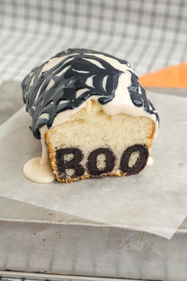 boo halloween cake with spiderweb icing