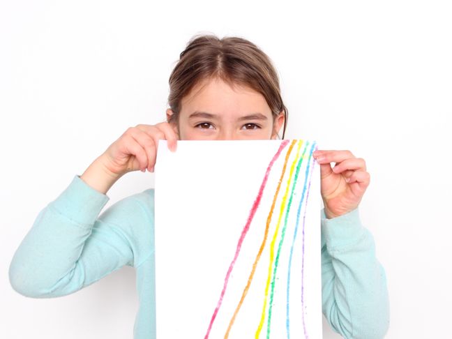 young-girl-holding-up-rainbow-salty-art