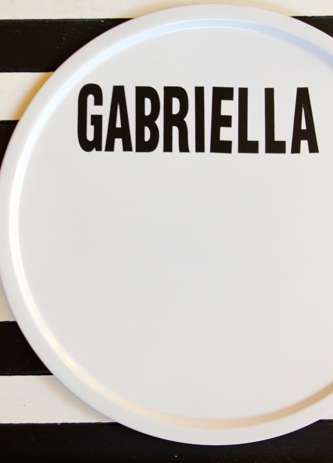 white-round-pizza-pan-with-black-letters-gabriella