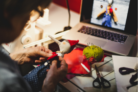 Woman Making Toy