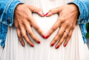 Pregnant Belly with Heart-Shaped Hands