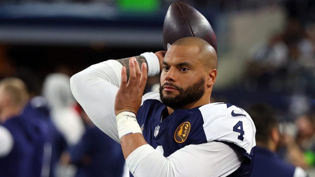 Dak Prescott #4 of the Dallas Cowboys warms up on the sidelines during a game against the Washington Commanders at AT&T Stadium on November 23, 2023 in Arlington, Texas.