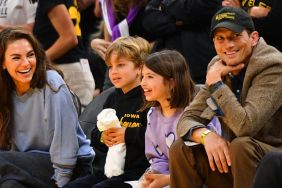 Actors Mila Kunis and Ashton Kutcher and their children look on during the WNBA basketball game between the Indiana Fever and the Los Angeles Sparks on May 24, 2024, at Crypto.com Arena in Los Angeles, CA.