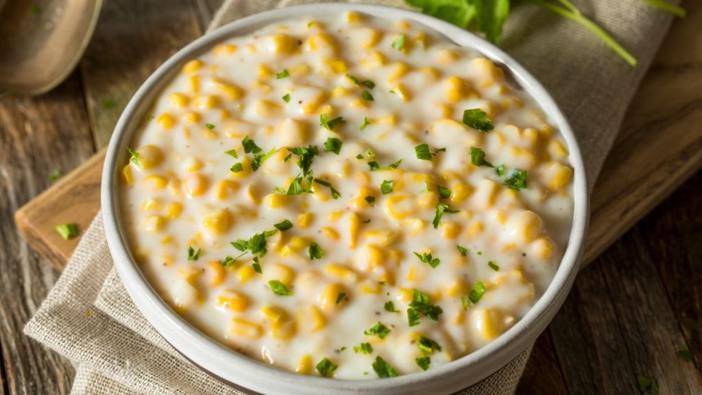 Fresh Homemade Creamed Corn in a Bowl, a Thanksgiving dinner recipe you can easily make using a slow cooker.