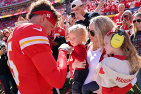 Patrick Mahomes #15 of the Kansas City Chiefs fist bumps his son, Bronze, while his wife and daughter, Brittany and Sterling, watch prior to a game against the Denver Broncos at GEHA Field at Arrowhead Stadium on November 10, 2024 in Kansas City, Missouri.