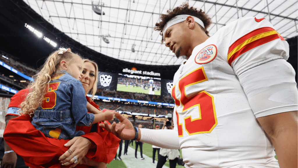 Patrick Mahomes #15 of the Kansas City Chiefs greets wife, Brittany, and daughter, Sterling, prior to a game against the Las Vegas Raiders at Allegiant Stadium on October 27, 2024 in Las Vegas, Nevada.