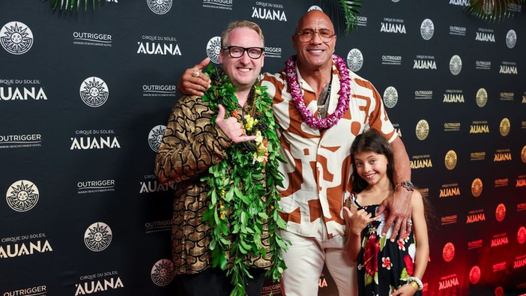 Neil Dorward, Director of 'Auana, (l-r) Dwayne "The Rock" Johnson and his daughter Jasmine Johnson at the global premiere of Cirque du Soleil 'Auana at the OUTRIGGER Waikiki Beachcomber Hotel, a show blending Hawaiian legends with Cirque's iconic acrobatics.