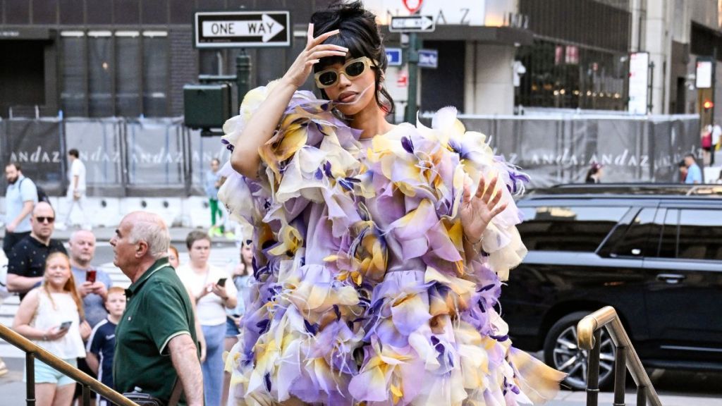 Cardi B is seen wearing a Marc Jacobs sheer ruffled outfit, yellow leggings outside the Marc Jacobs show on July 01, 2024 in New York City.