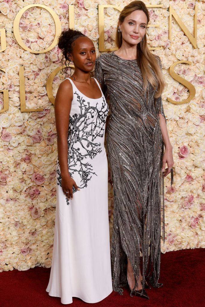 US actress Angelina Jolie (R) and her daughter Zahara Jolie arrive for the 82nd annual Golden Globe Awards at the Beverly Hilton hotel in Beverly Hills, California, on January 5, 2025.