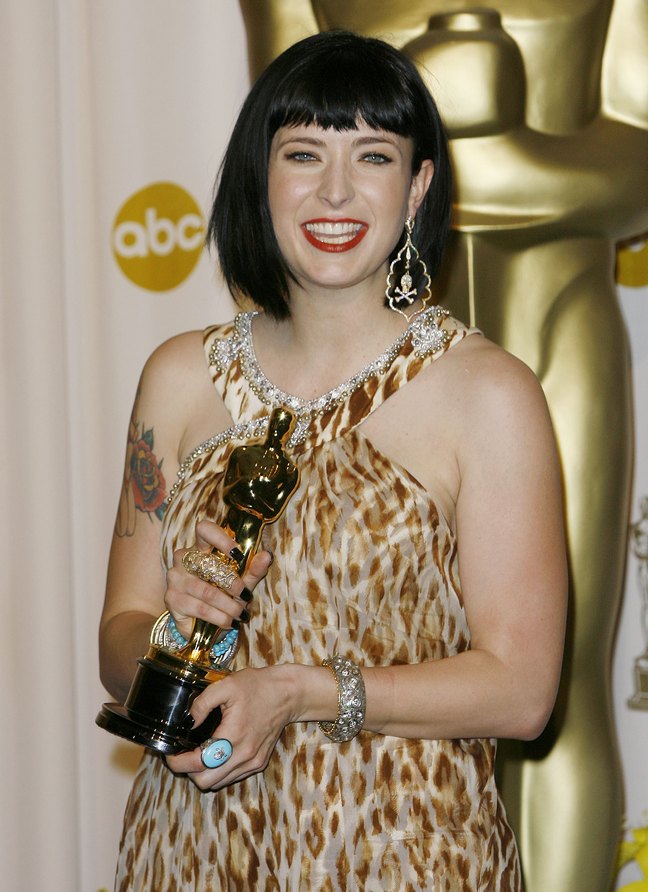 Diablo Cody, academy award, turquois ring, skull and bones earrings, animal print dress, bracelets