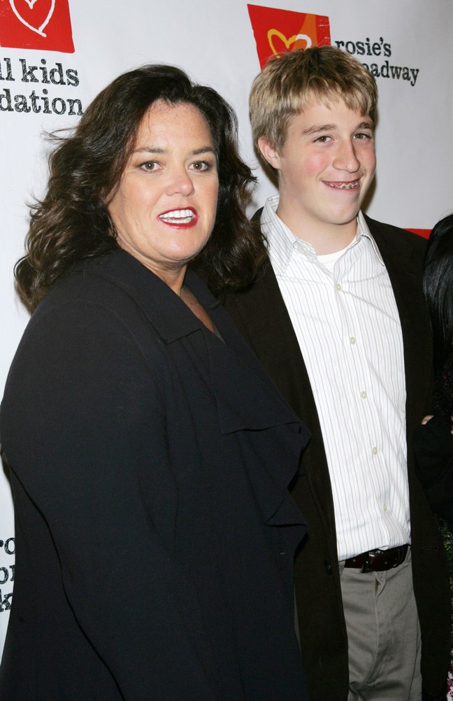 Rosie O'Donnell, black suit, Parker O'Donnell, suit jacket, gray slacks, white striped button down shirt, belt