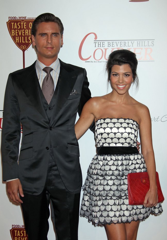 kourtney kardashian, black and white strapless dress, black belt, red clutch, scott disick, suit